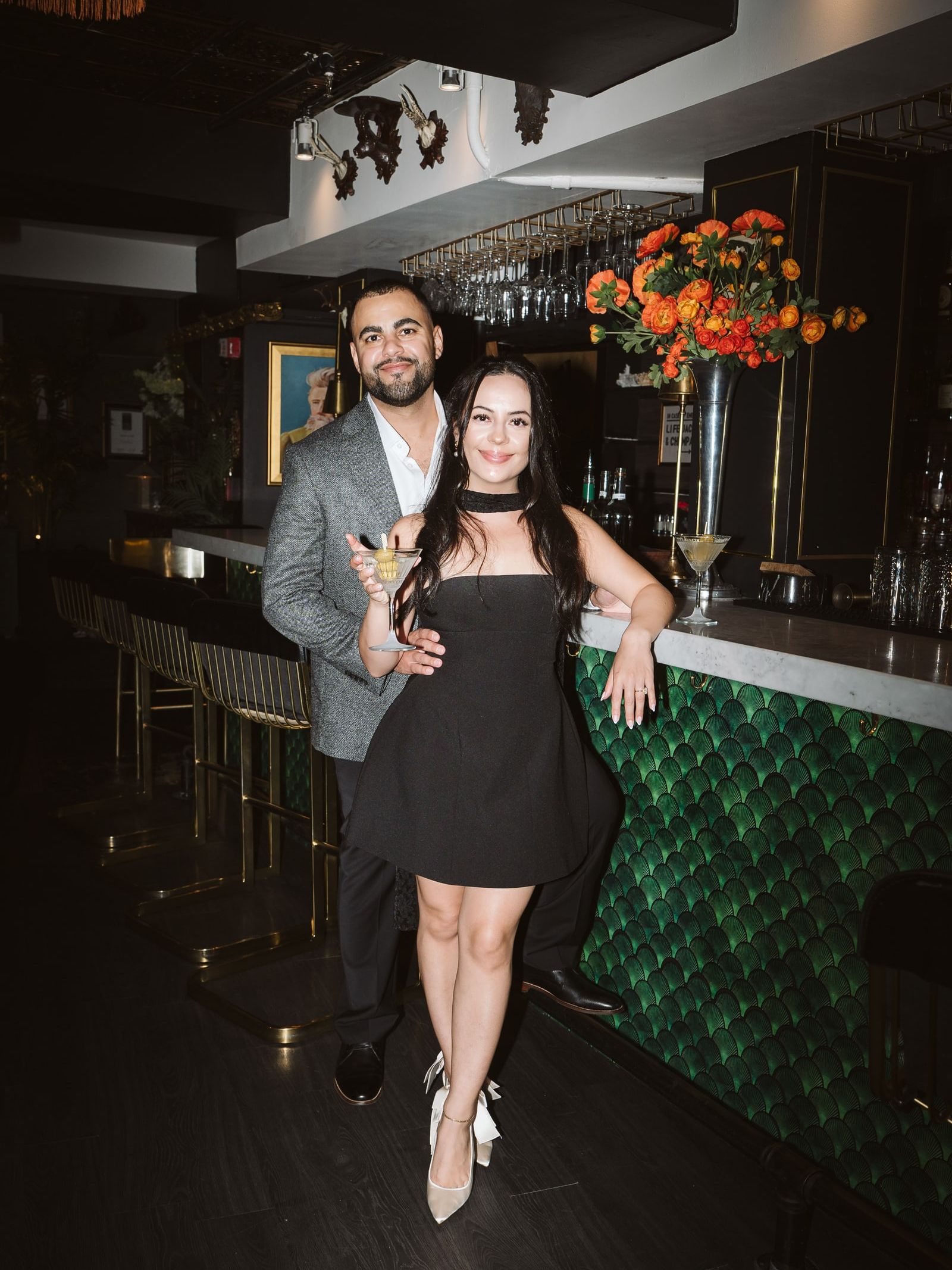 Doug and Julie at the bar, martinis in hand